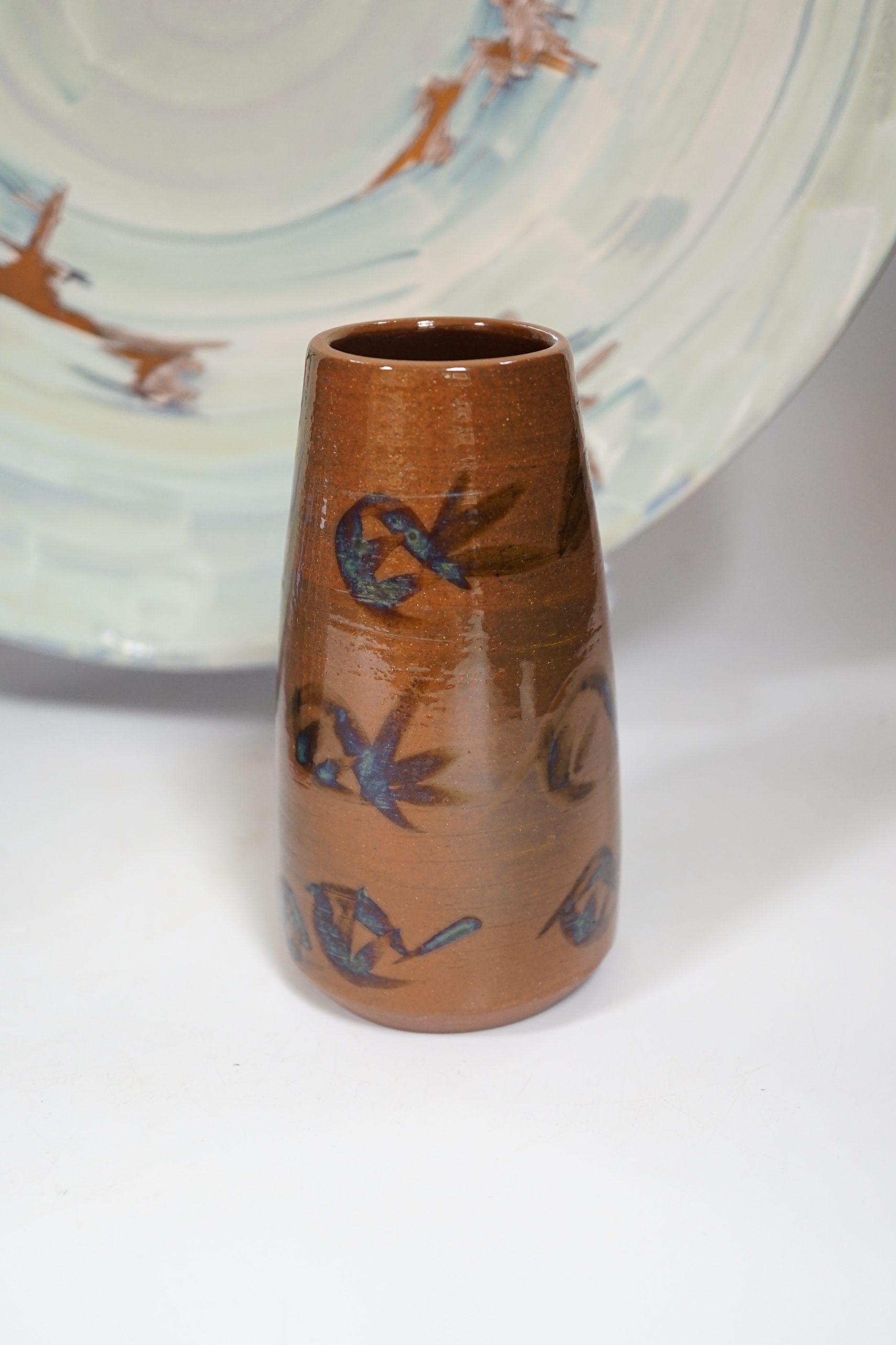 A Poole pottery lustre charger, initialled ‘MS’, 40cm and two vases with abstract designs, largest 40cm in diameter